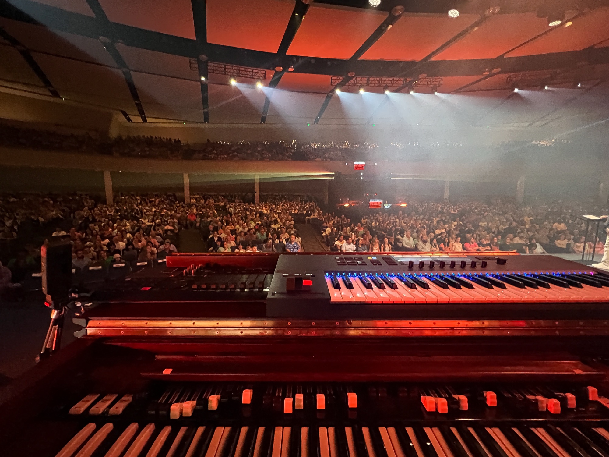 View from behind the Hammond organ over a packed auditorium